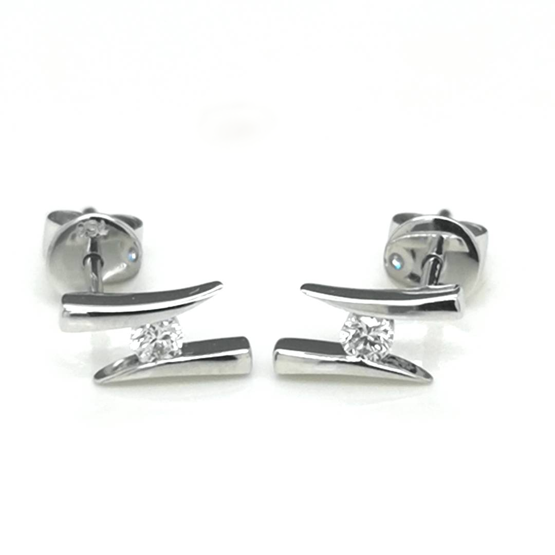 Solitaire Diamond Stud Earrings In 18k White Gold.