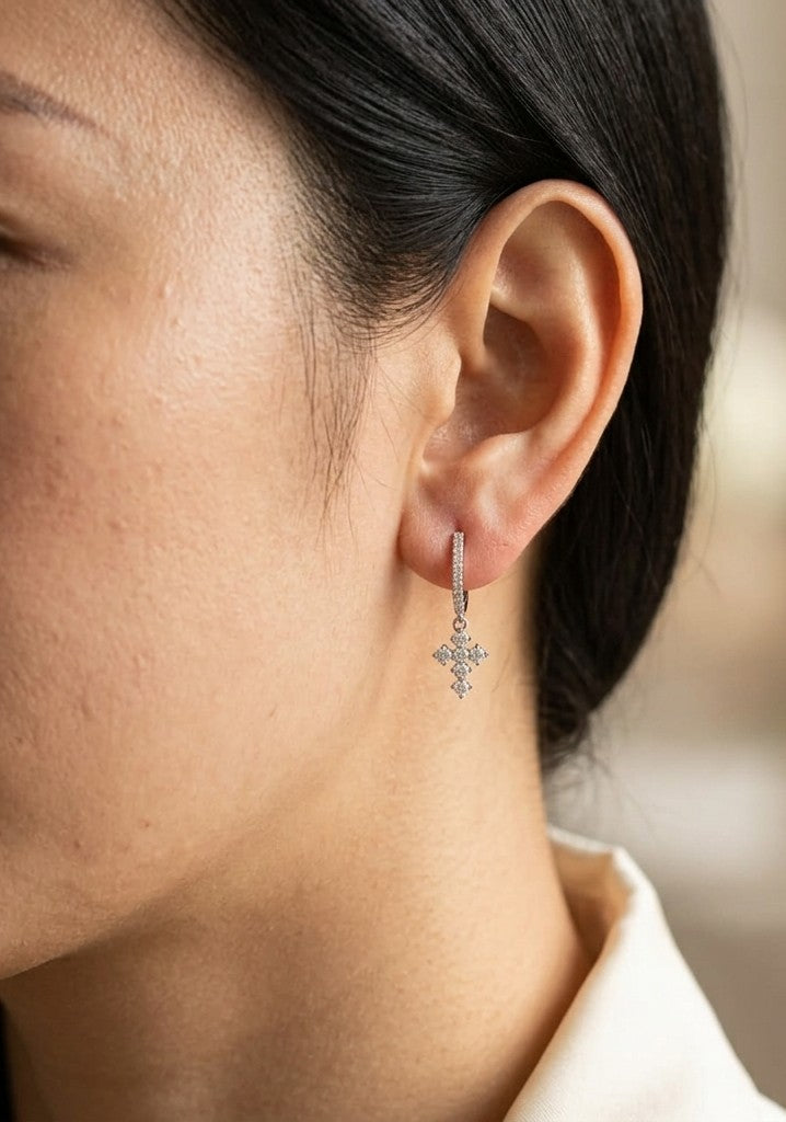 18K white gold diamond cross drop earrings featuring diamond-set hoops and suspended round brilliant diamond cross charms.