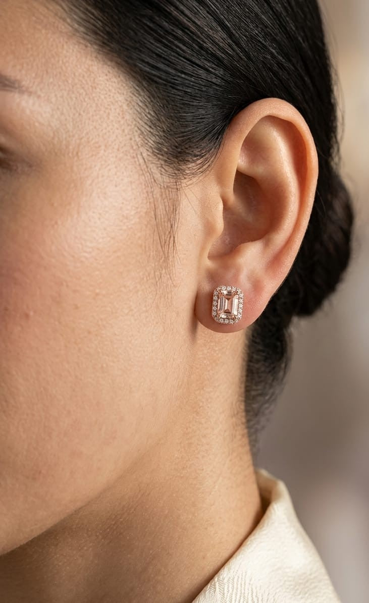 18K rose gold morganite and diamond halo stud earrings with emerald-cut morganites.
