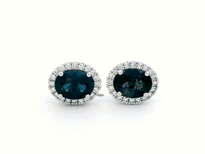 Oval London Blue Topaz & Diamond Halo Stud Earrings In 18k Gold.