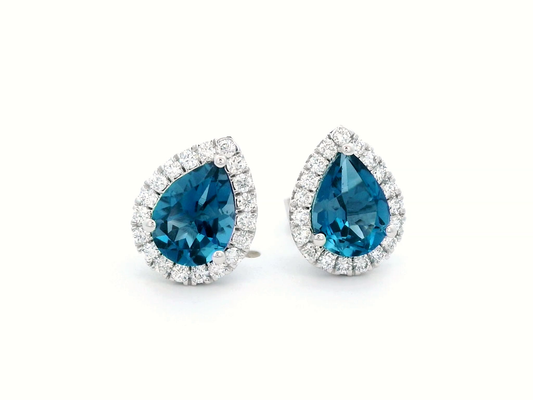 18k gold earrings featuring a pair of 2.53-carat total London Blue Topaz stones, surrounded by a total of 0.39-carat diamonds in a halo design.