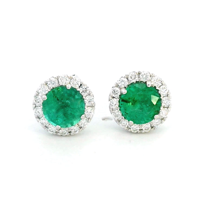 A pair of elegant 18K gold earrings featuring 1.11 carats of round-cut emeralds surrounded by a 0.25-carat halo of sparkling round diamonds, with push-back closures.