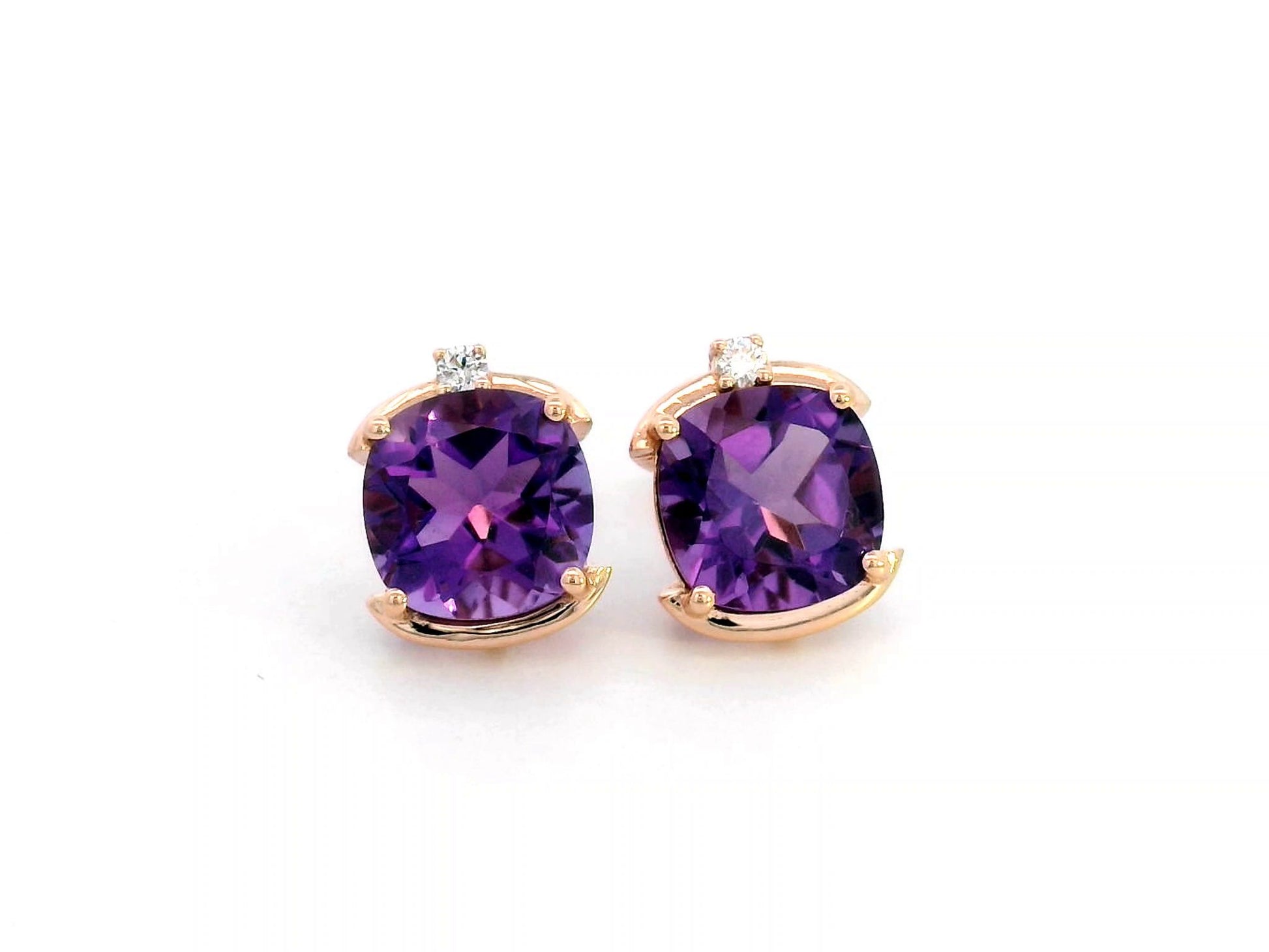 18K gold cushion-cut amethyst stud earrings featuring vibrant 3.99-carat amethysts with diamond accents totaling 0.05 carat.