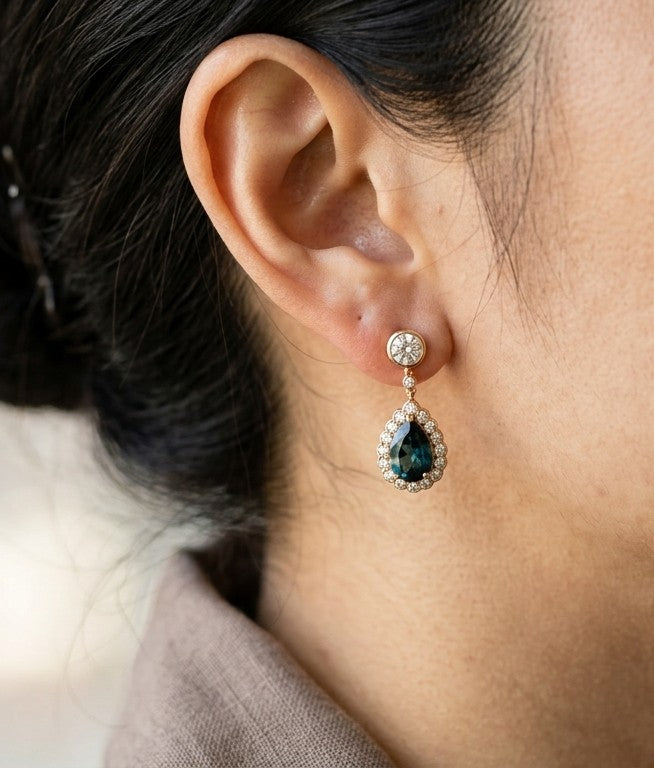Pear shaped London Blue Topaz and diamond drop earrings in 18K rose gold with diamond halos and round diamond stud tops