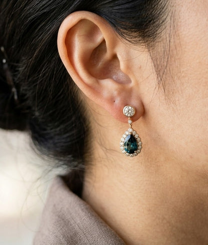 Pear shaped London Blue Topaz and diamond drop earrings in 18K rose gold with diamond halos and round diamond stud tops