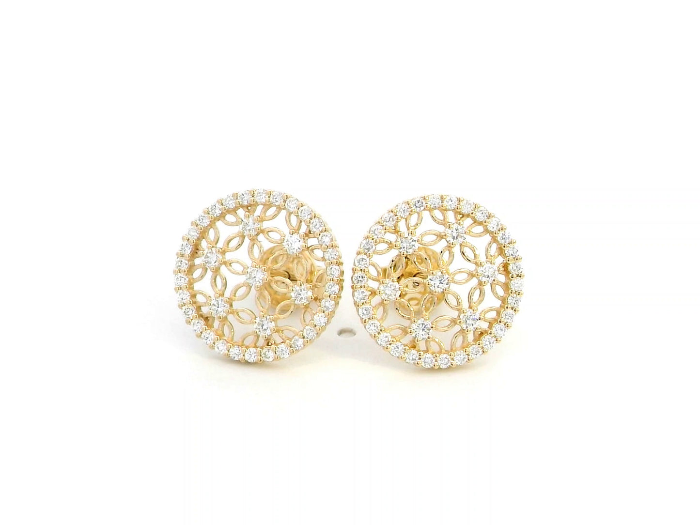 18K yellow gold filigree stud earrings featuring an intricate vintage-inspired openwork floral design, adorned with 0.69 carats of round diamonds and a delicate diamond halo, secured with push-back closures.