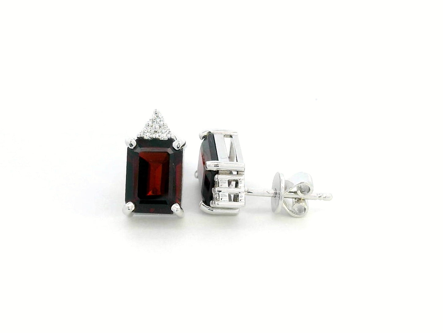 18K white gold garnet and diamond stud earrings featuring emerald-cut garnets (4.11 CT total) with a delicate diamond cluster (0.09 CT total), set in a classic and elegant stud design.