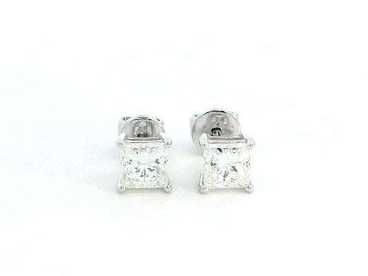 Princess-cut diamond solitaire stud earrings in 18K white gold, 1.01 carat total, GIA certified.
