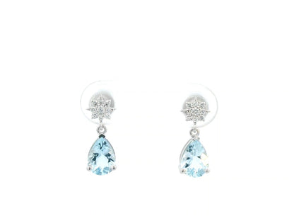 18K white gold aquamarine and diamond drop earrings featuring pear-cut aquamarine gemstones (1.08 CT total) and a brilliant diamond cluster (0.11 CT total), set in a classic drop design.