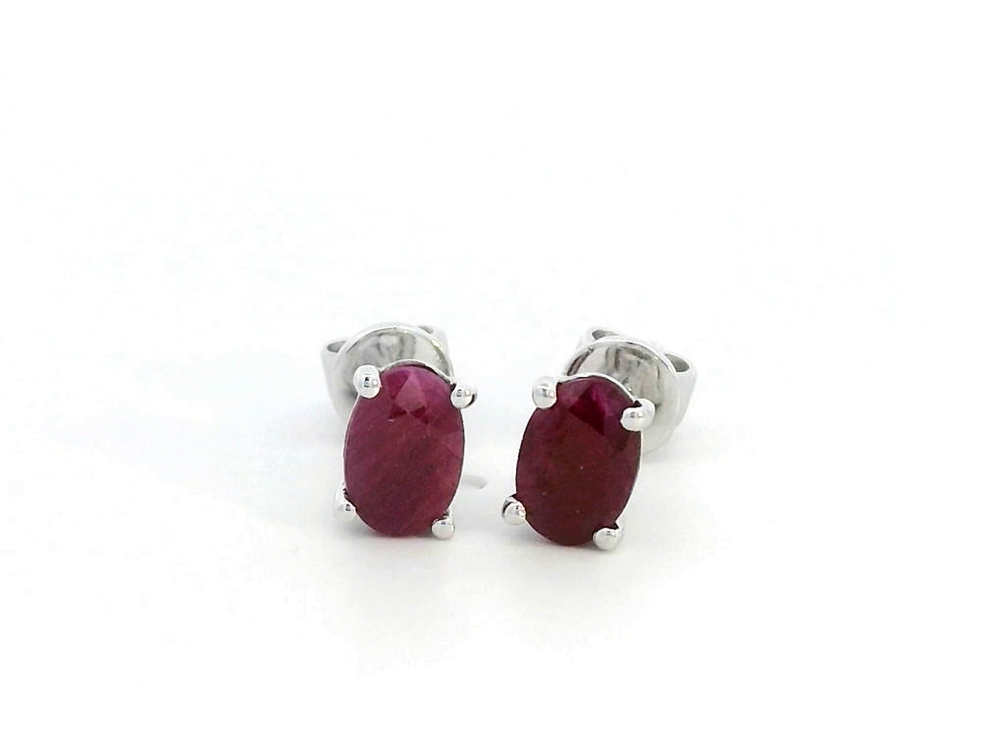 1.50 carat oval ruby stud earrings in 18K gold setting, July birthstone