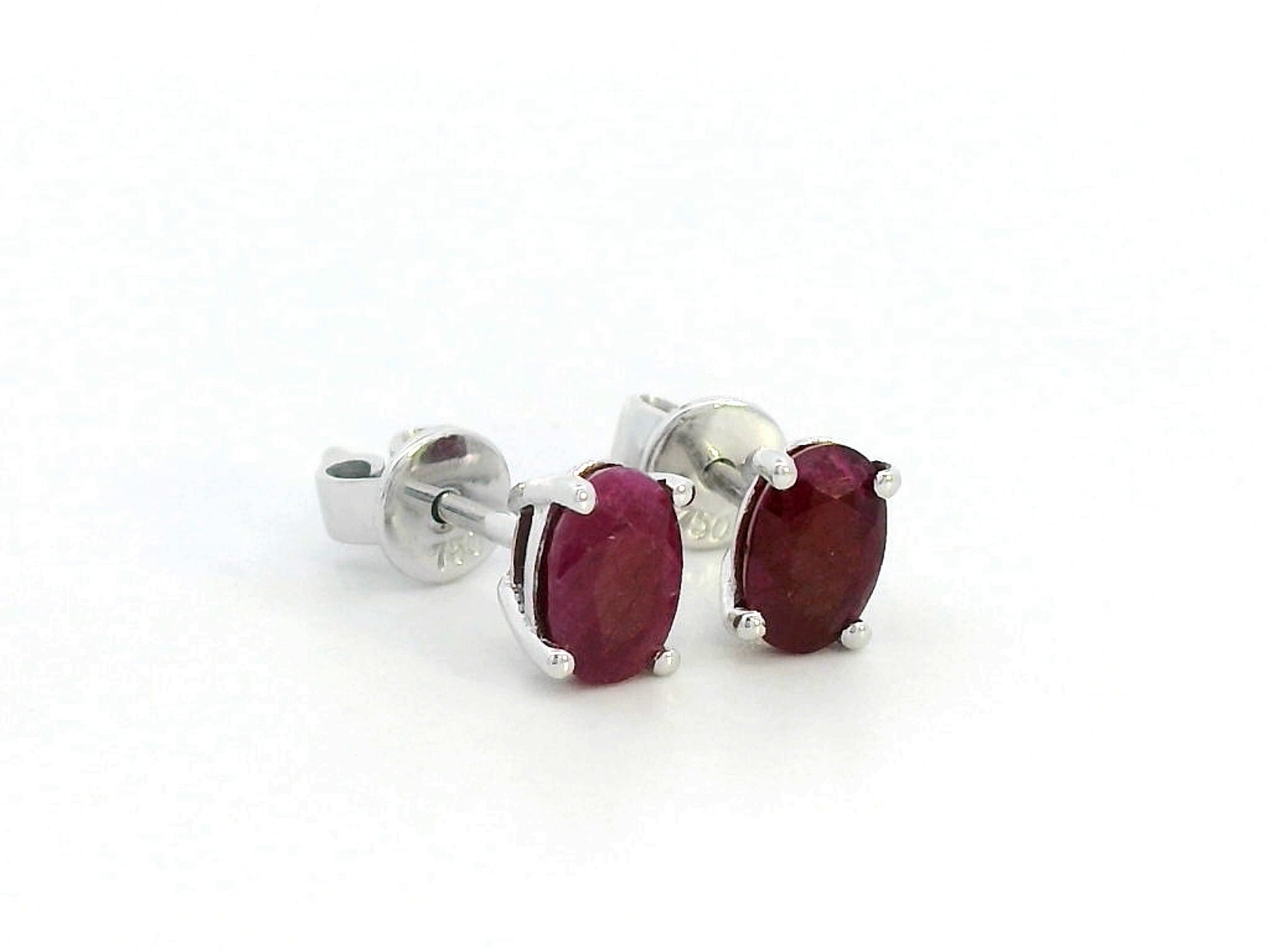 1.50 carat oval ruby stud earrings in 18K gold setting, July birthstone