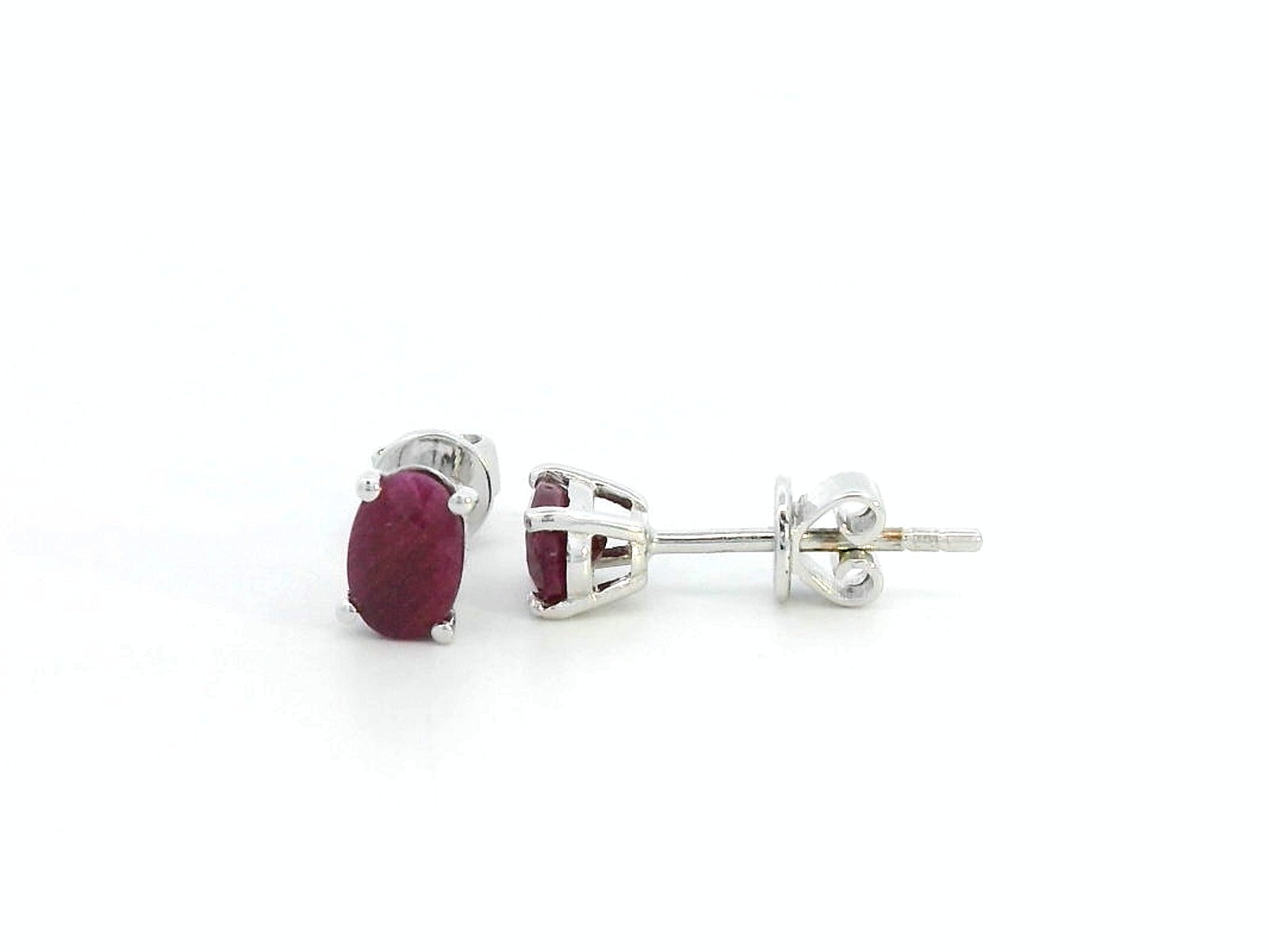 1.50 carat oval ruby stud earrings in 18K gold setting, July birthstone