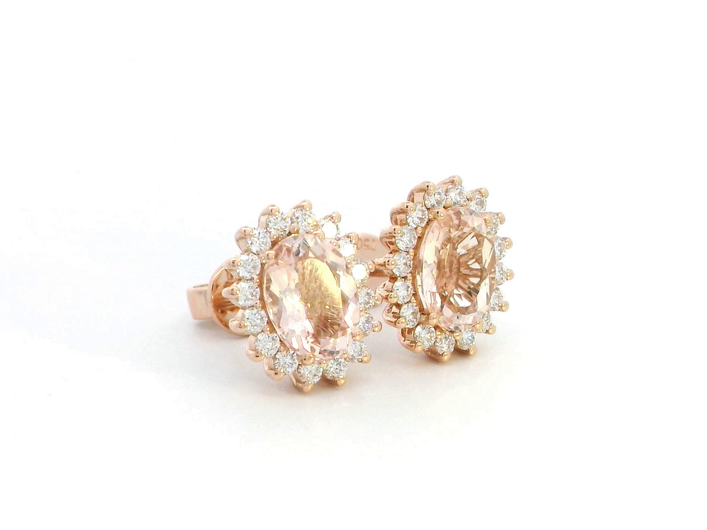 Diana-style 18K rose gold halo stud earrings featuring oval-cut morganites (2.77 carats) and round-cut diamonds (0.56 carats) in a regal, vintage-inspired design.