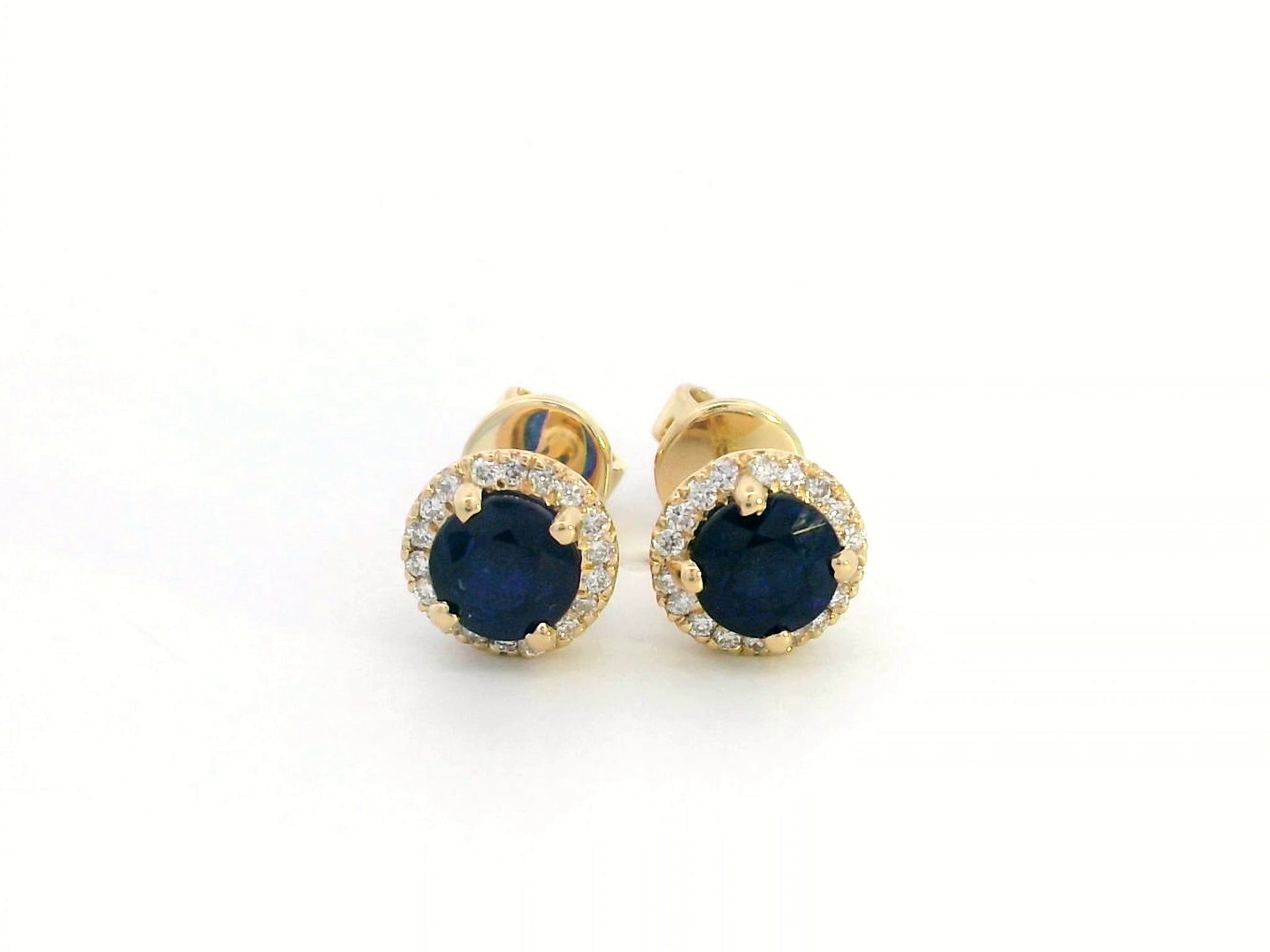 18K Gold Sapphire and Diamond Halo Stud Earrings featuring 1.48 carats of deep blue round-cut sapphires and 0.17 carats of brilliant diamonds