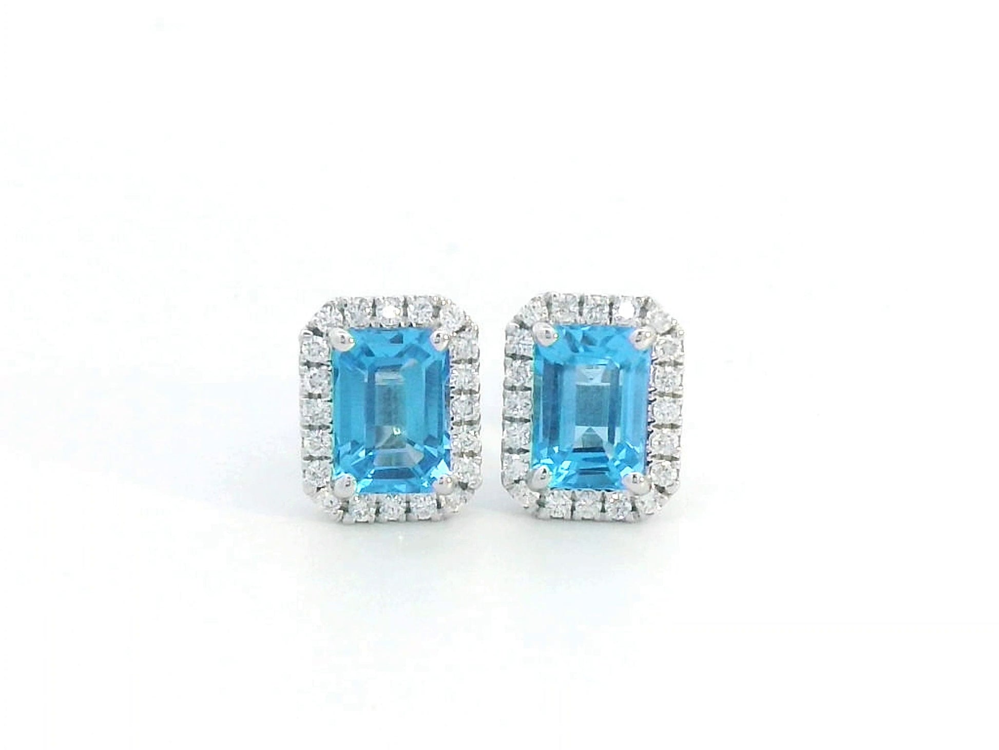 18K white gold blue topaz stud earrings with diamond halo, emerald-cut 2.18 CT gemstones, elegant gemstone earrings for women, December birthstone jewelry.