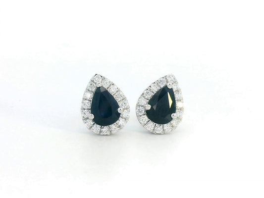 18K white gold pear-shaped blue sapphire and diamond halo stud earrings featuring 1.92 carats of blue sapphires and 0.38 carats of diamonds.