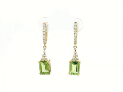 Emerald-cut Peridot and diamond drop earrings in 18K white gold, featuring vibrant green gemstones and brilliant diamond accents.