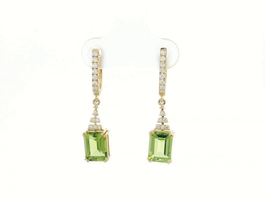 Emerald-cut Peridot and diamond drop earrings in 18K white gold, featuring vibrant green gemstones and brilliant diamond accents.