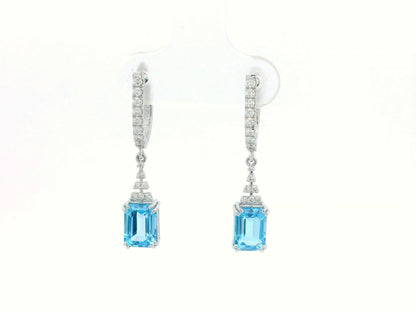 Emerald-cut Blue Topaz dangle earrings with diamond-studded huggie hoops in 18K white gold