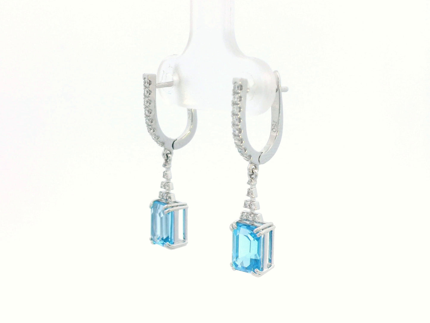 Emerald-cut Blue Topaz dangle earrings with diamond-studded huggie hoops in 18K white gold