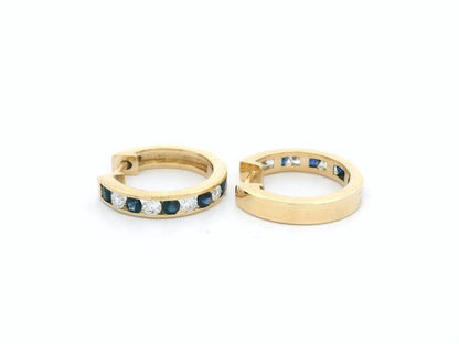 18K gold sapphire and diamond hoop earrings with alternating gemstones.

