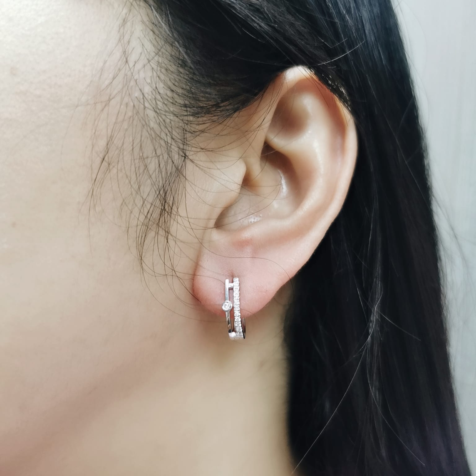 Two-row 18K white gold huggie earrings with pavé and bezel-set diamonds