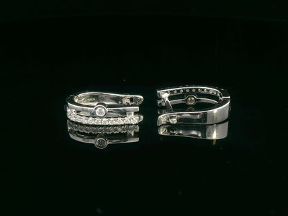 Two-row 18K white gold huggie earrings with pavé and bezel-set diamonds
