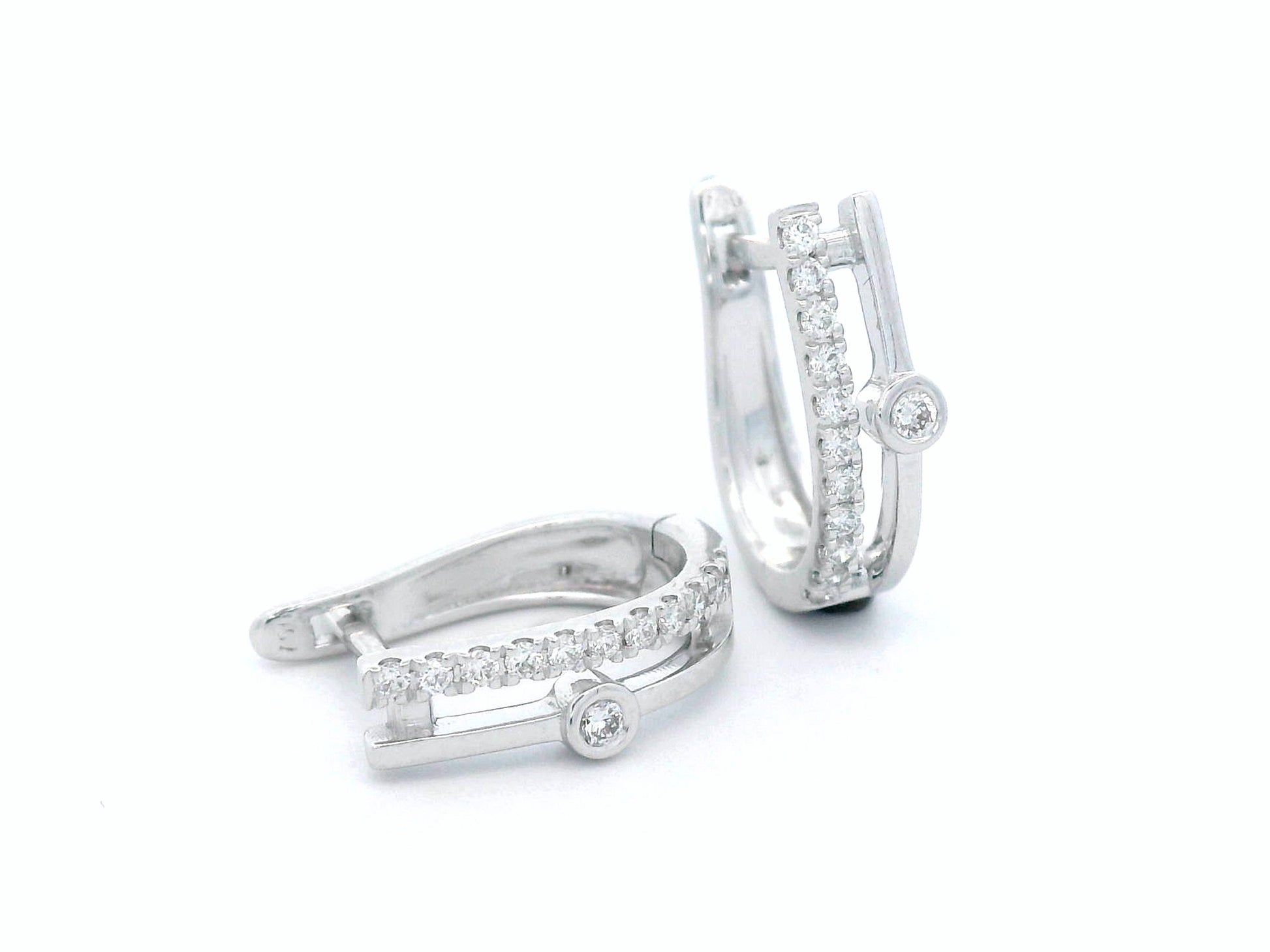 Two-row 18K white gold huggie earrings with pavé and bezel-set diamonds