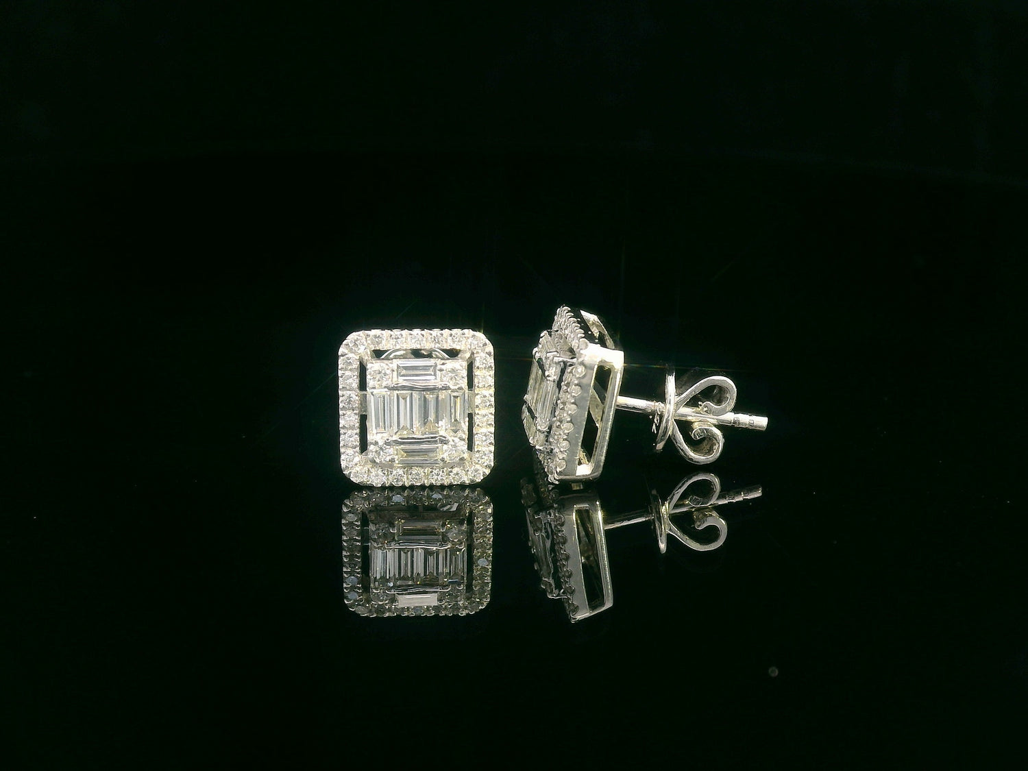 18K gold diamond cluster stud earrings with 0.56 carats of round and baguette-cut diamonds, featuring a secure butterfly back.
