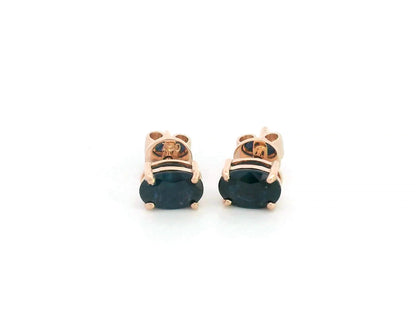 18K rose gold stud earrings with oval-cut natural blue sapphires totaling 1.06 carats, four-prong set with butterfly push backs.