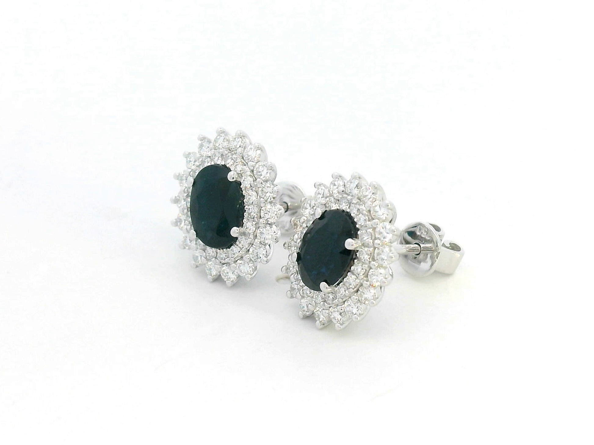 18K white gold earrings with oval blue sapphires (2.12ct) and double diamond halos (0.84ct total)