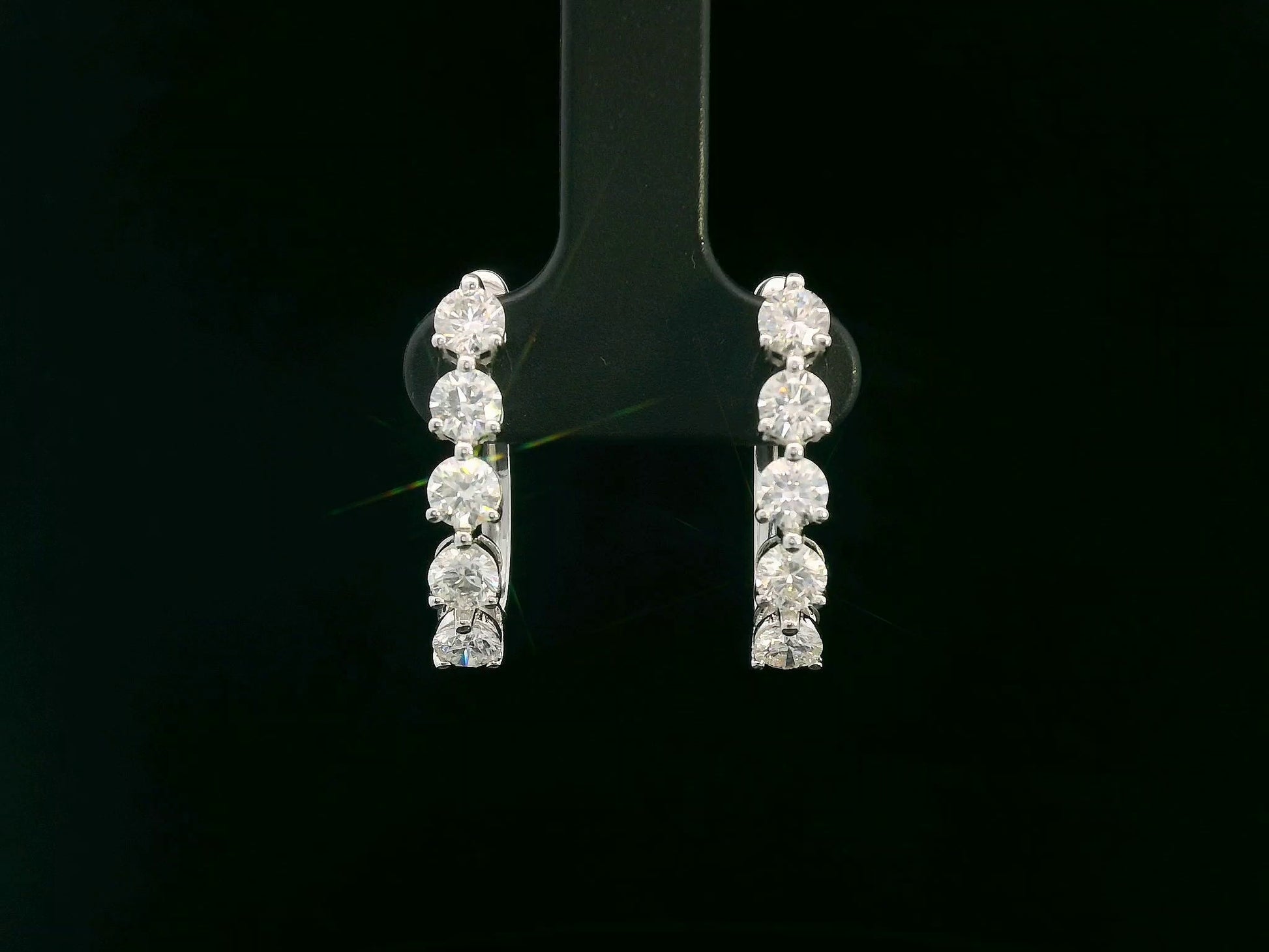 18K white gold hoop earrings with 1.90 carats of round brilliant diamonds arranged in a front-facing design

