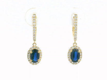 Elegant 18K gold drop earrings with 0.98ct oval blue sapphires and 0.26ct diamond halo and hoop design