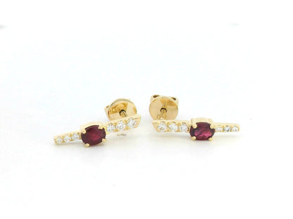 18K gold vertical earrings with 0.51ct oval rubies and 0.16ct round diamonds in a linear design with screw-back posts