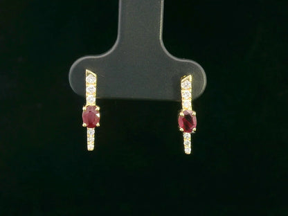 18K gold vertical earrings with 0.51ct oval rubies and 0.16ct round diamonds in a linear design with screw-back posts