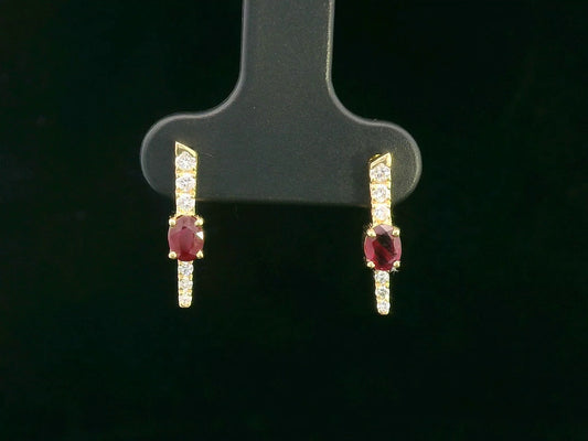 Ruby and diamond bar earrings in 18K yellow gold with oval rubies and round diamond detailing