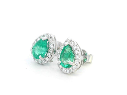 Pear-cut emerald and diamond halo earrings in 18K white gold

