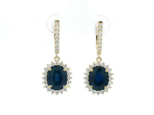 18K yellow gold earrings with 6.41ct oval blue sapphires and 0.91ct diamond sunburst halo design