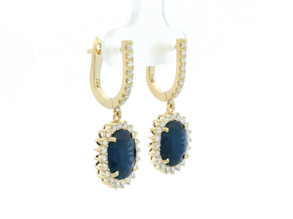 18K yellow gold earrings with 6.41ct oval blue sapphires and 0.91ct diamond sunburst halo design