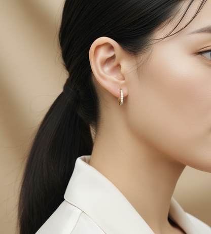 18K yellow gold diamond huggie hoop earrings – pavé-set 0.12ct diamonds by Emirates Diamonds