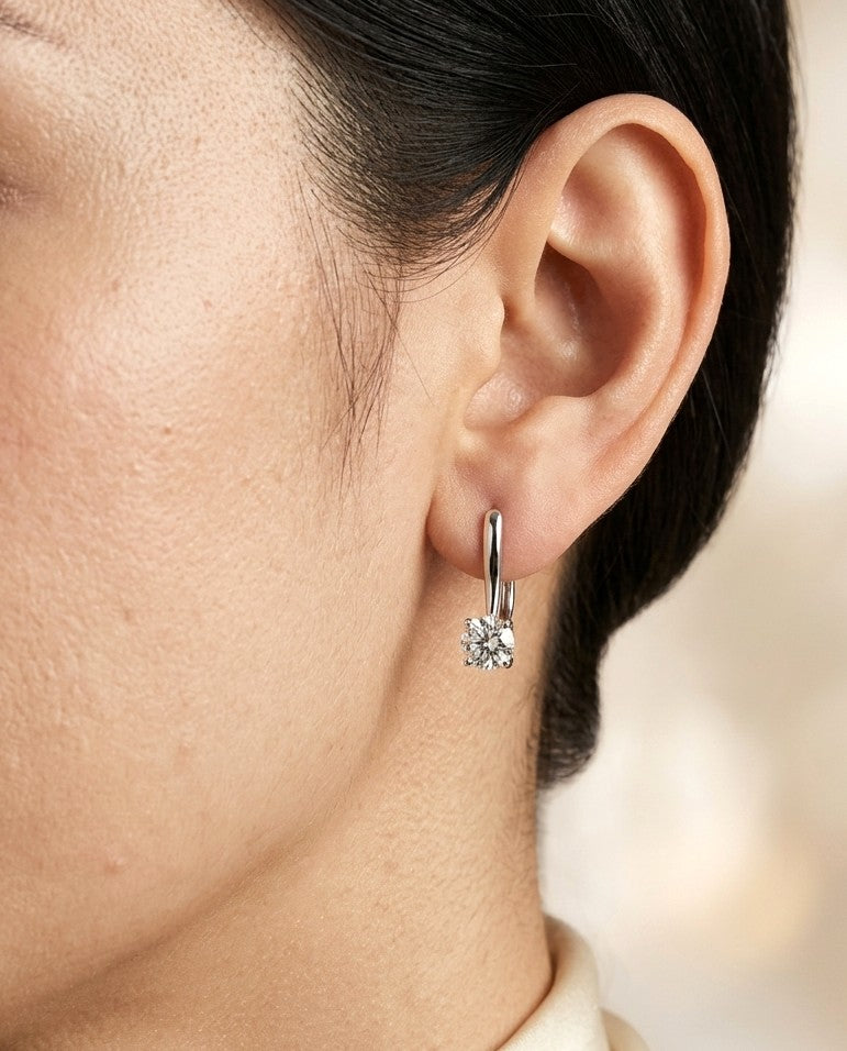 GIA certified round diamond drop earrings in 18K white gold featuring 1.00 and 1.01 carat natural diamonds
