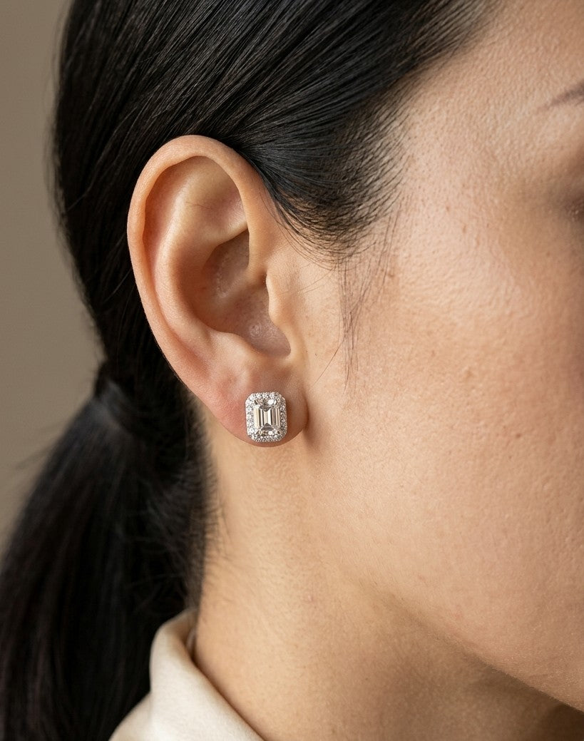 GIA certified emerald cut diamond halo stud earrings in 18K white gold with D colour VS2 centre diamonds