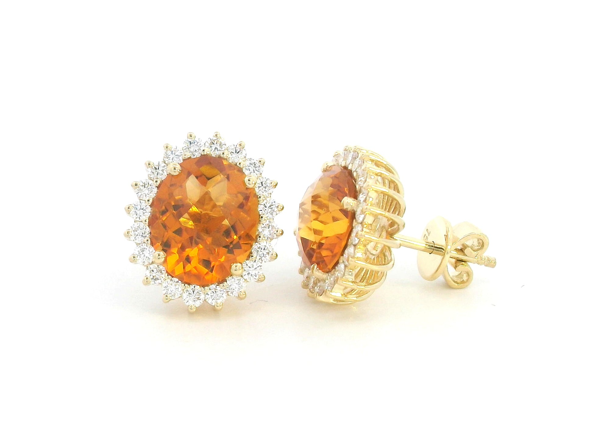 Oval amber-hued citrine stud earrings in 18K yellow gold with diamond sunburst halo – 5.35 carats total