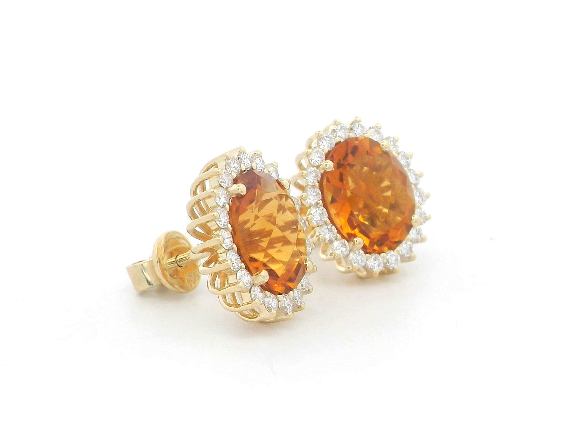 Oval amber-hued citrine stud earrings in 18K yellow gold with diamond sunburst halo – 5.35 carats total