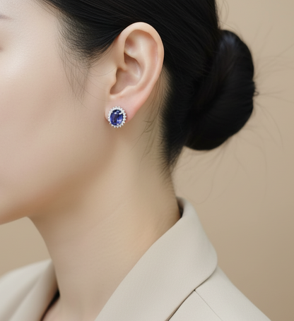 18K white gold cabochon tanzanite and diamond halo stud earrings – 7.27 ct tanzanite with 0.70 ct diamonds by Emirates Diamonds