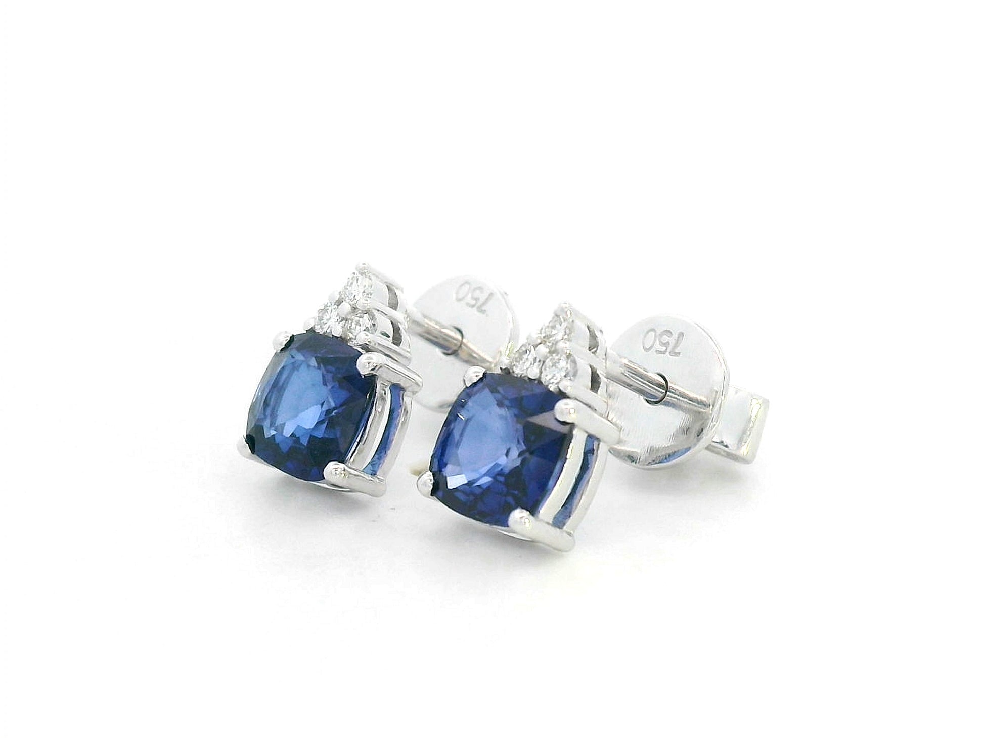 Elegant sapphire stud earrings with diamond details in 18K white gold