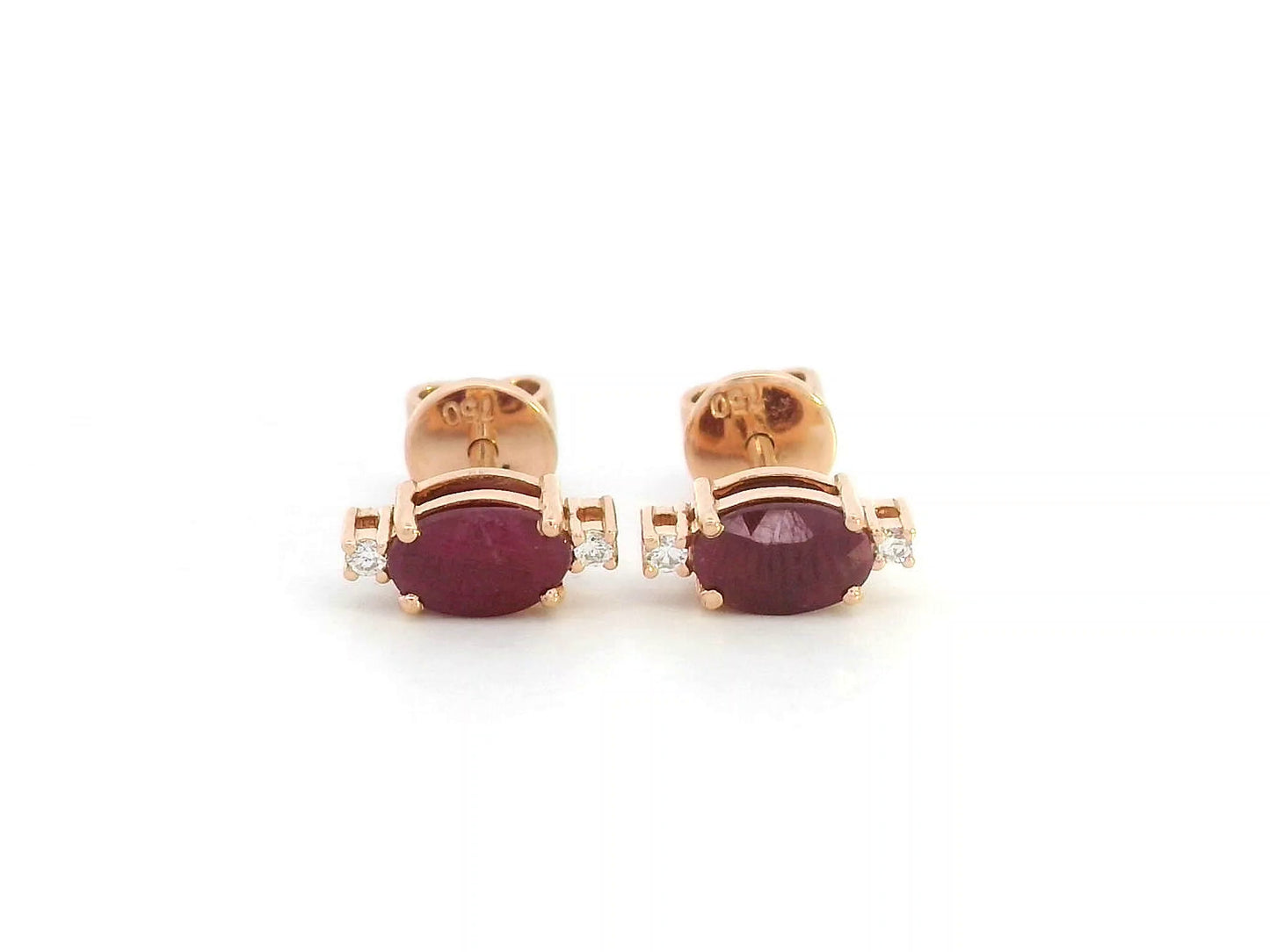 18K rose gold ruby stud earrings with diamond accents – close-up view