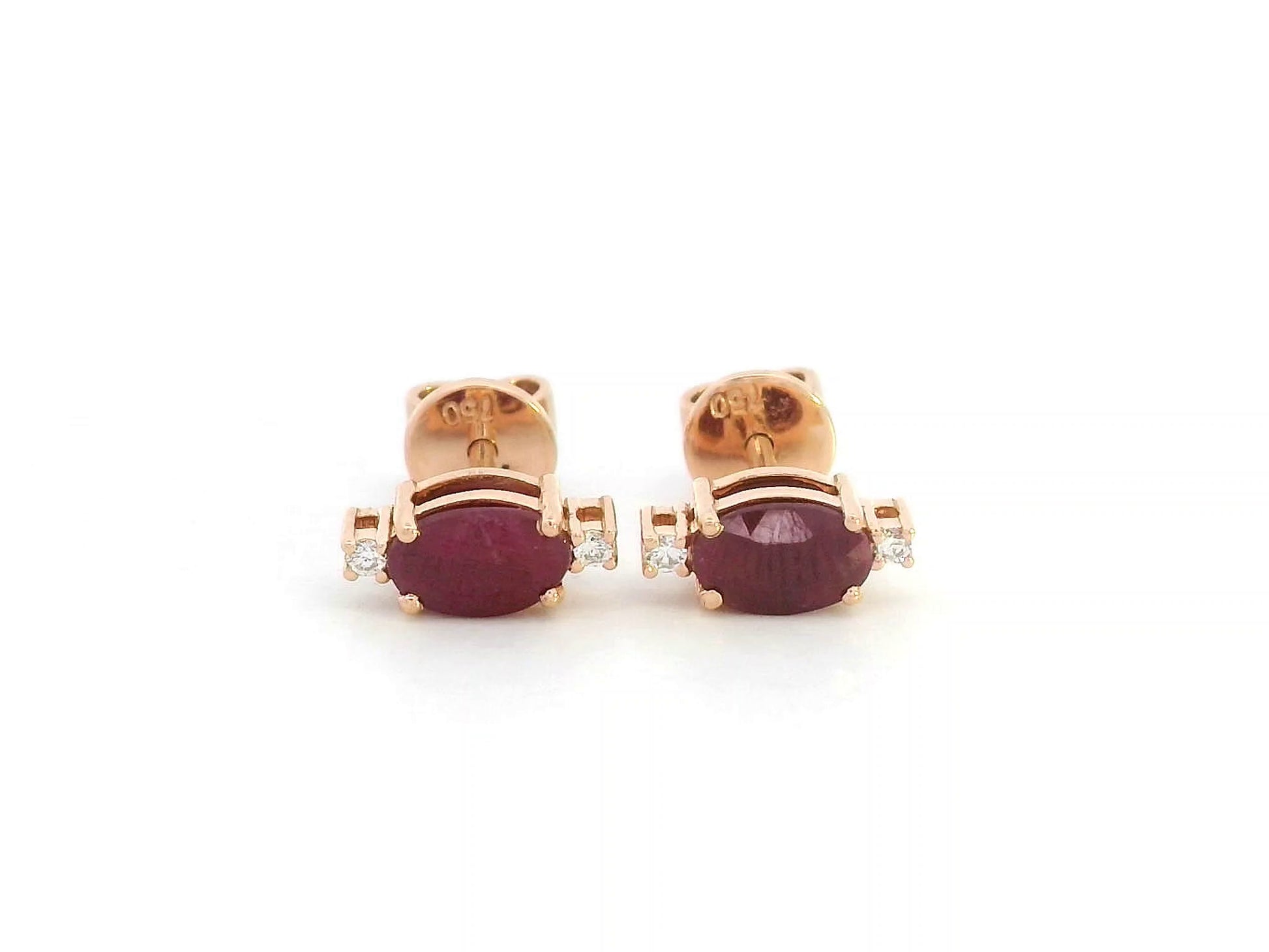 18K rose gold ruby stud earrings with diamond accents – close-up view