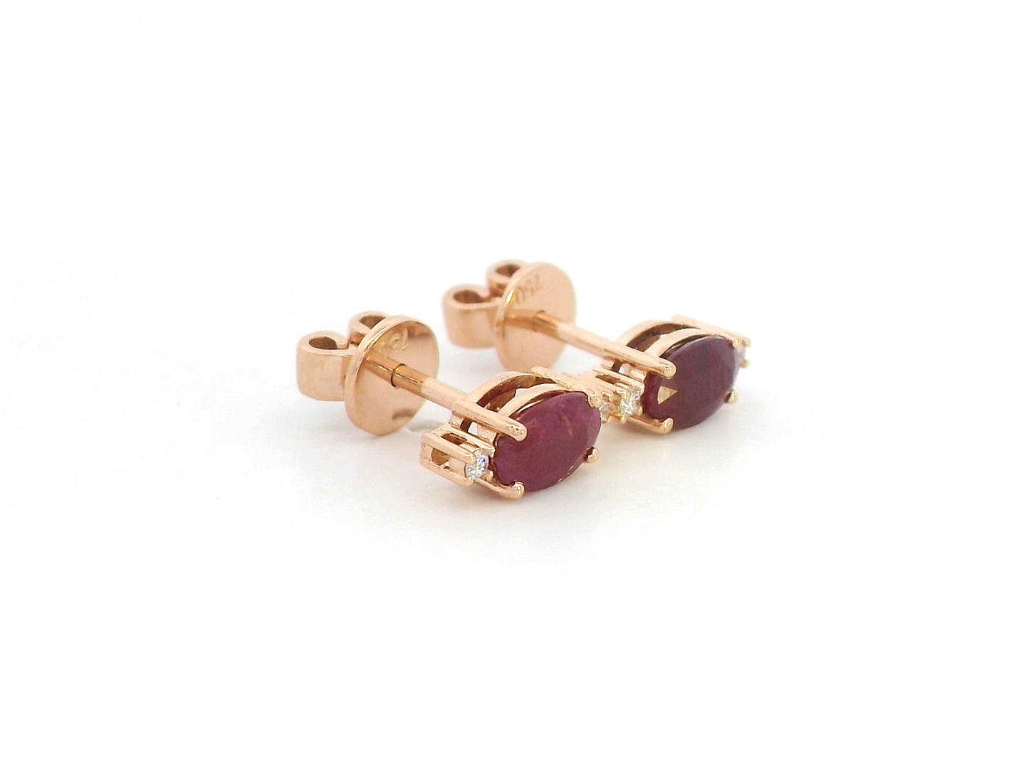 Pair of ruby stud earrings with diamonds – photographed on white background