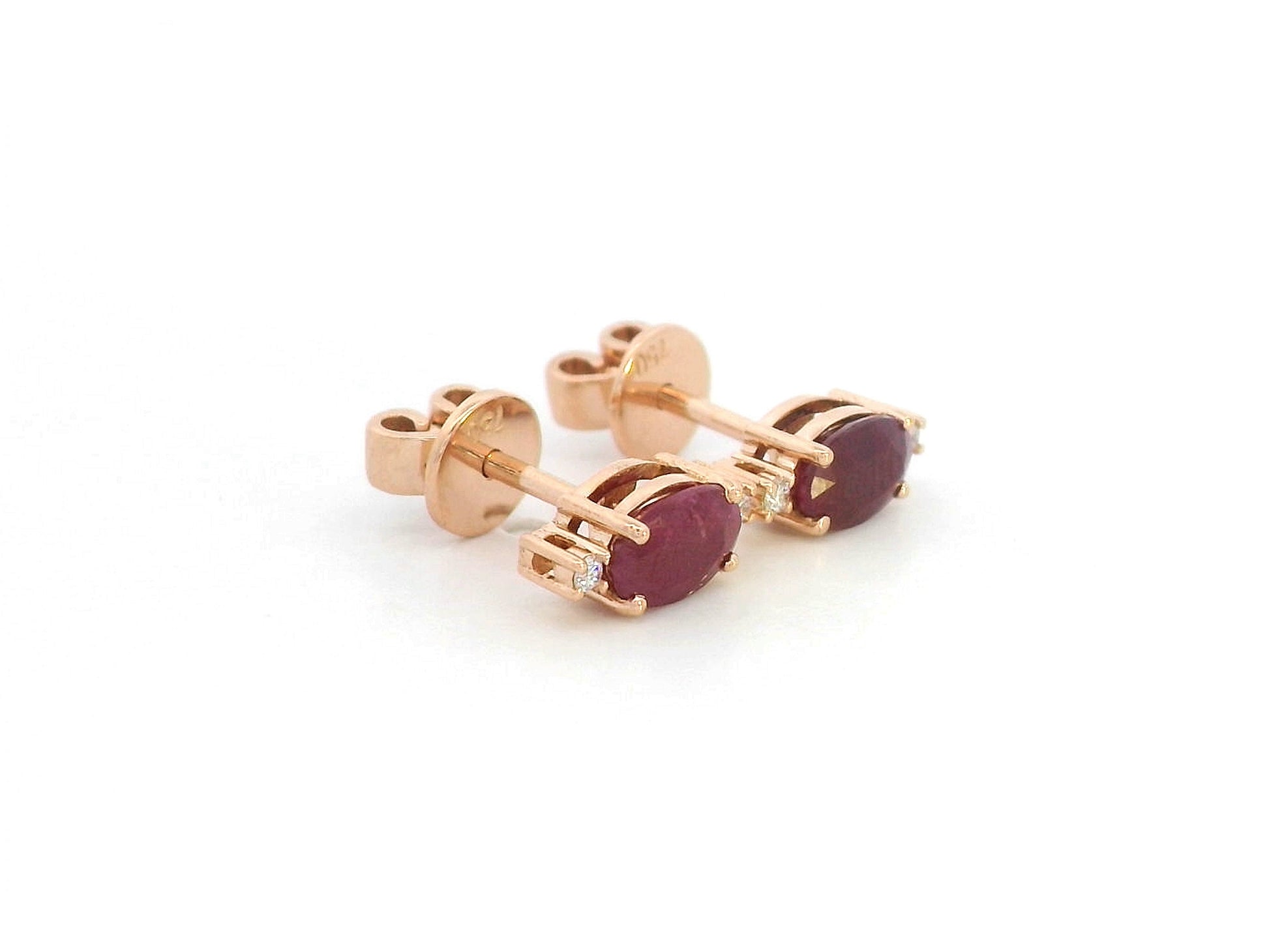 Pair of ruby stud earrings with diamonds – photographed on white background